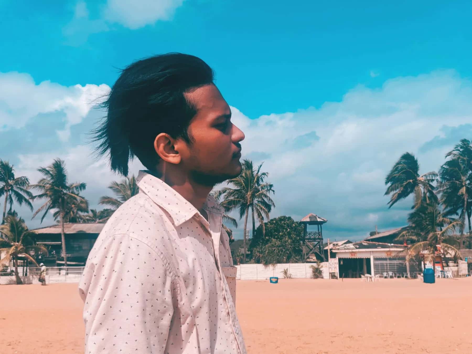 Sayuru Akash Amarasinghe standing by the coast in Sri Lanka